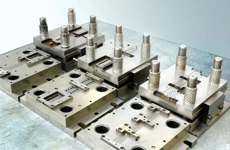 Precision metal press tooling and die components used for industrial manufacturing and fabrication.